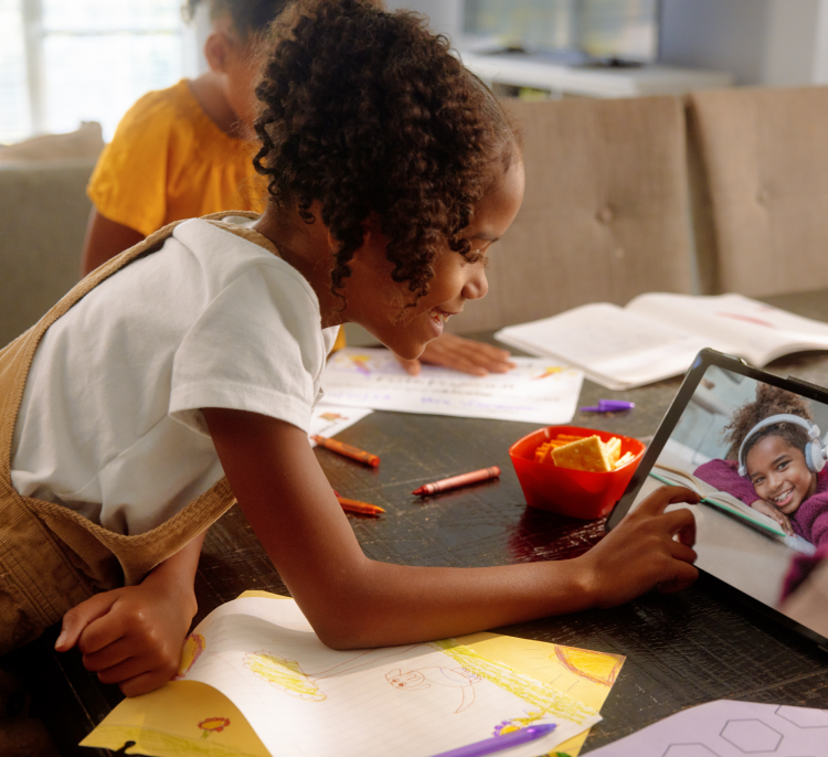 A girl and her friend are having a video call on a tablet powered by Brightspeed Internet.